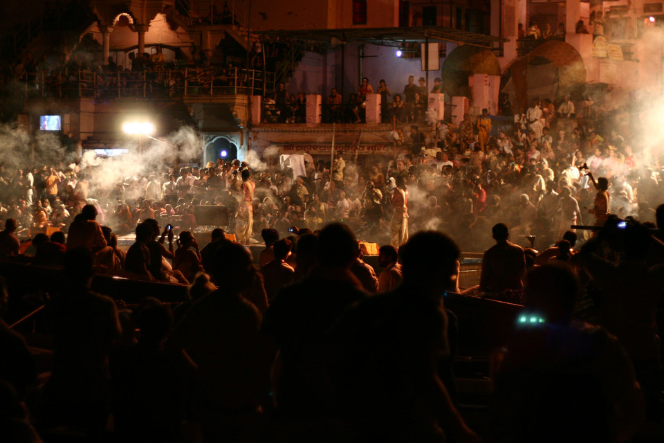 People gathered at an outdoor café at night